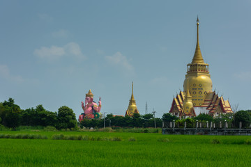 Naklejka premium Thai temple nearby field