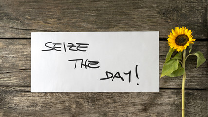 Seize the day message written on white card