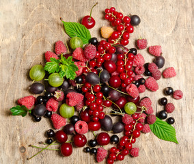 Summer berries on wooden background