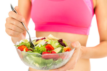 Fitness woman with a bowl of salad