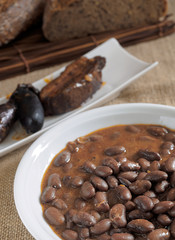 Beans with sausage and black pudding