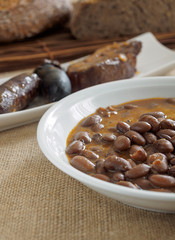 Beans with sausage and black pudding