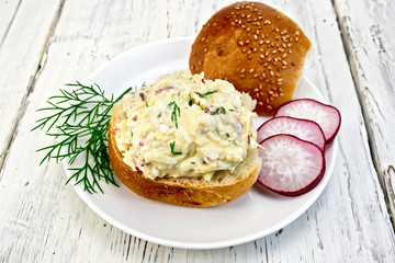Appetizer of radish and cheese on bun in plate