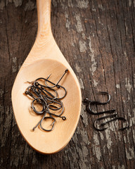 fish hook on wood background