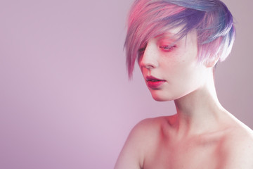 young girl with pink eyes and hair, like a doll
