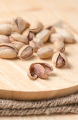 seed of pistachio nut on wood background