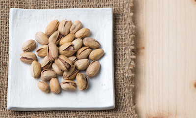 pistachio nut on wood background