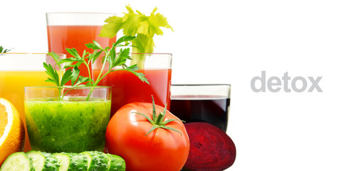 Glasses with fresh organic vegetable and fruit juices on white