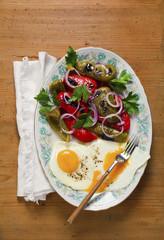 Breakfast with eggs and vegetables. Salad of sweet pepper. bread