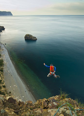 base-jumper jumps from the cliff 