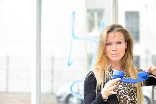 Beautiful Fair Hair Woman Holding Blue Phone In An Old Phone Boo