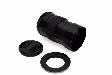 Lens with an adapter and a protective cover on a white backgroun