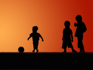 silhouette of three little boys playing in sunset sky