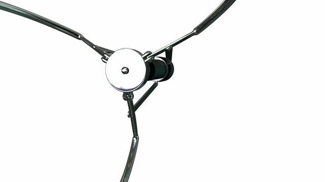 An arcade type robotic claw swinging across the camera and dipping down to pick something up on an isolated white background