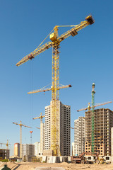 Fototapeta premium Construction crane against blue sky