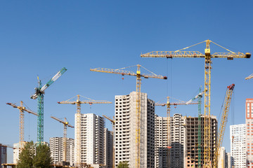 Fototapeta premium Construction crane against blue sky