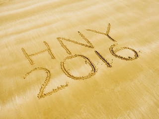 Happy New Year 2016 on sand beach