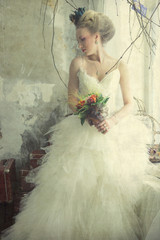 Fototapeta na wymiar Romantic young bride in vintage interior