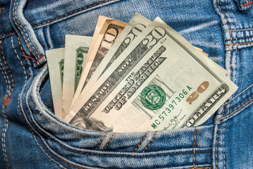 twenty dollar sticking out the blue jeans pocket