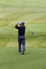 People move around the golf course