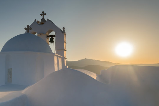 Beautiful church Saint Antony in Paros island in Greece against the sunset.
