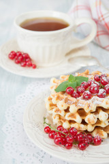 Breakfast with waffles and tea