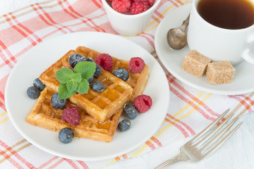 Breakfast with sweet waffles and coffee