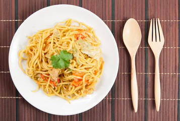 noodles and vegetables on wood
