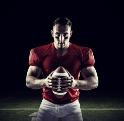 Composite image of american football player looking at camera