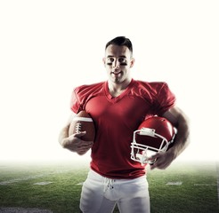 Composite image of american football player looking at camera