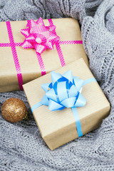 Christmas presents on a gray knitted background
