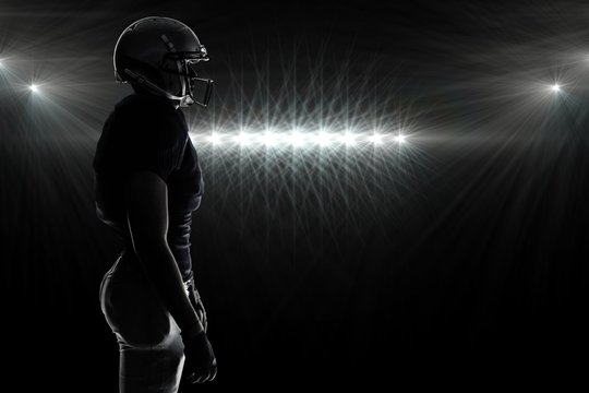 Composite image of silhouette american football player