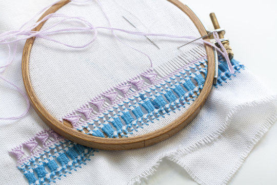 Openwork embroidery, incomplete work in progress and tools for embroidery