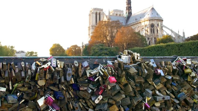 Paris, hundreds of love locks on a bridge behind Notre-Dame cathedral
