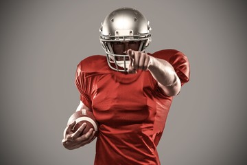 Composite image of portrait sports player in red jersey pointing