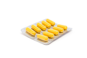 Herb powder capsule in blister pack on white background
