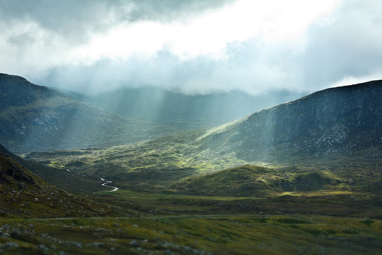 Clouds rays sun valley Scotland