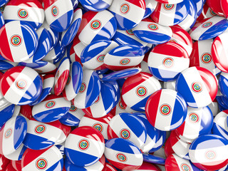Background with round pins with flag of paraguay