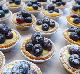 The close view of blueberry tarts in teatime