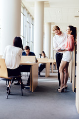 Fototapeta premium Young students studying together