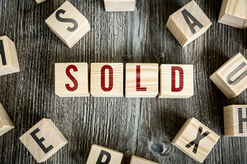Wooden Blocks with the text: Sold