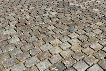Close-up of cobblestone road - background