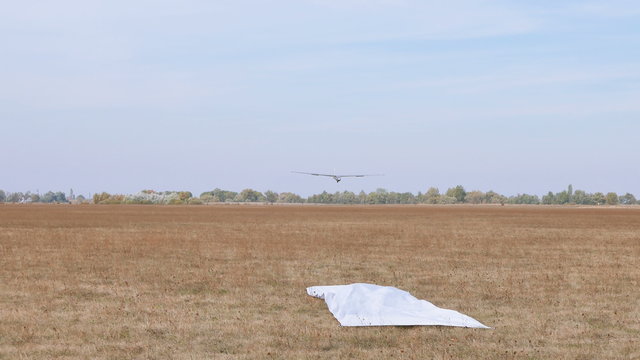 Glider  land on  soil field and open  airbrake. 4K 3840x2160