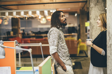 Colleagues in office talking