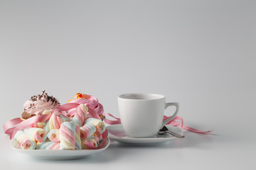 Pink cupcake with tea cup