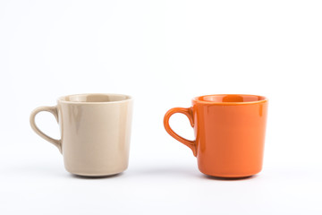 Orange offee cup and brown offee cup on white background