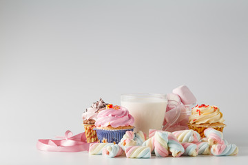 Heap of colored sweets on white background