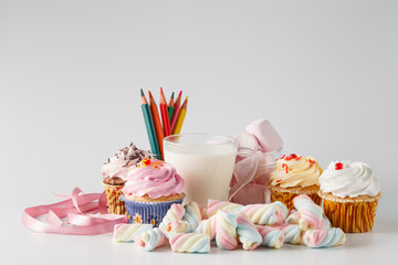 Heap of colored sweets on white background