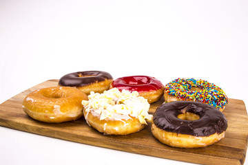 Donuts with board isolated on white background