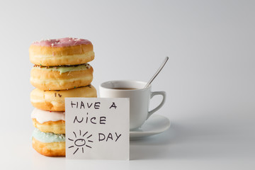 Colored donuts on white plain background